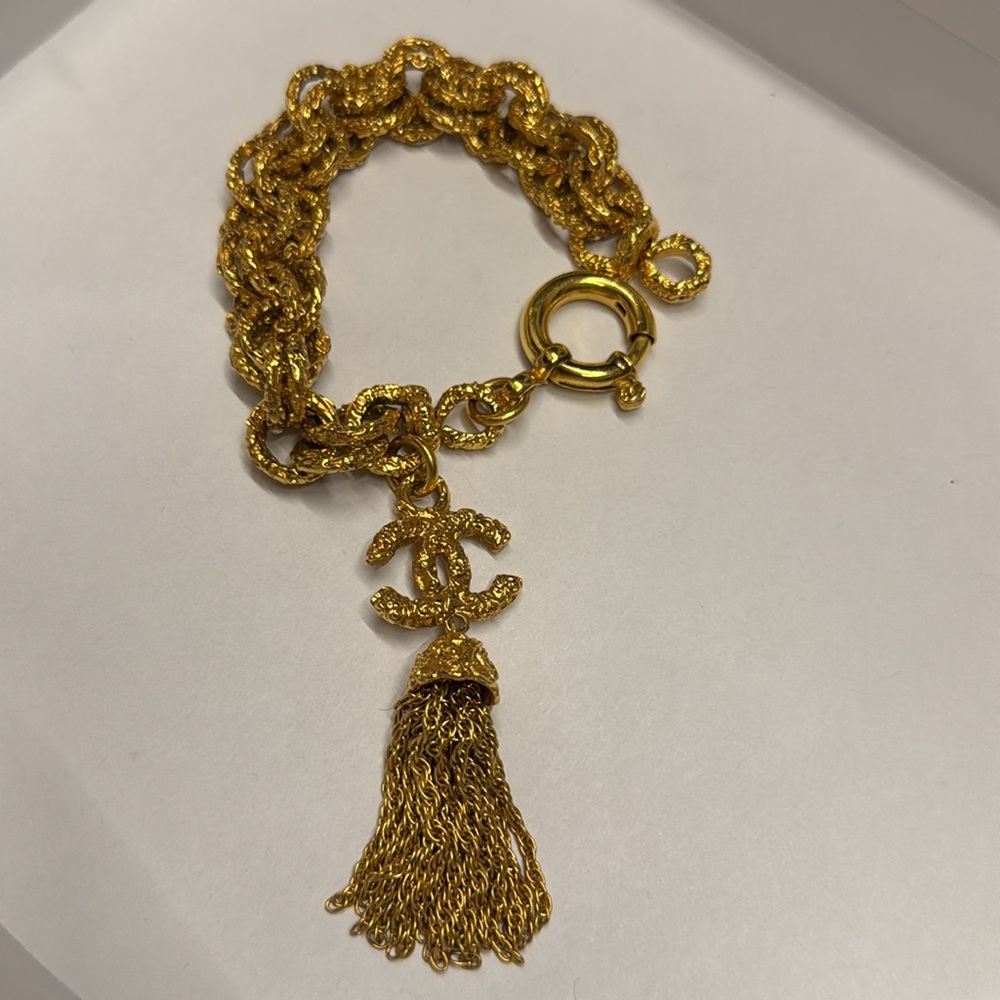 Chanel CC Lava 93A Tassel Textured Bracelet Gold tone